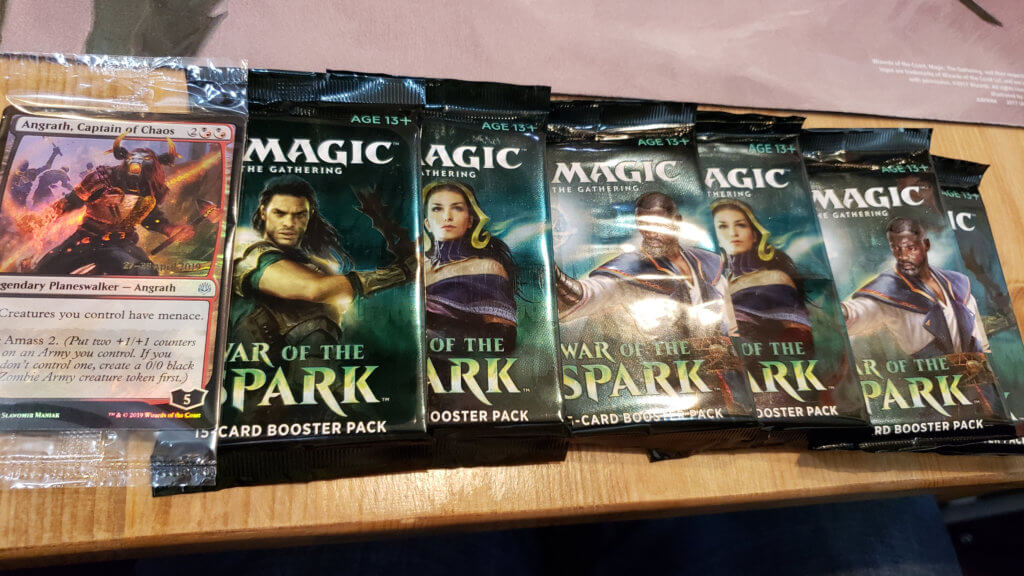 A spread of booster packs and limited-edition cards for deck creation.